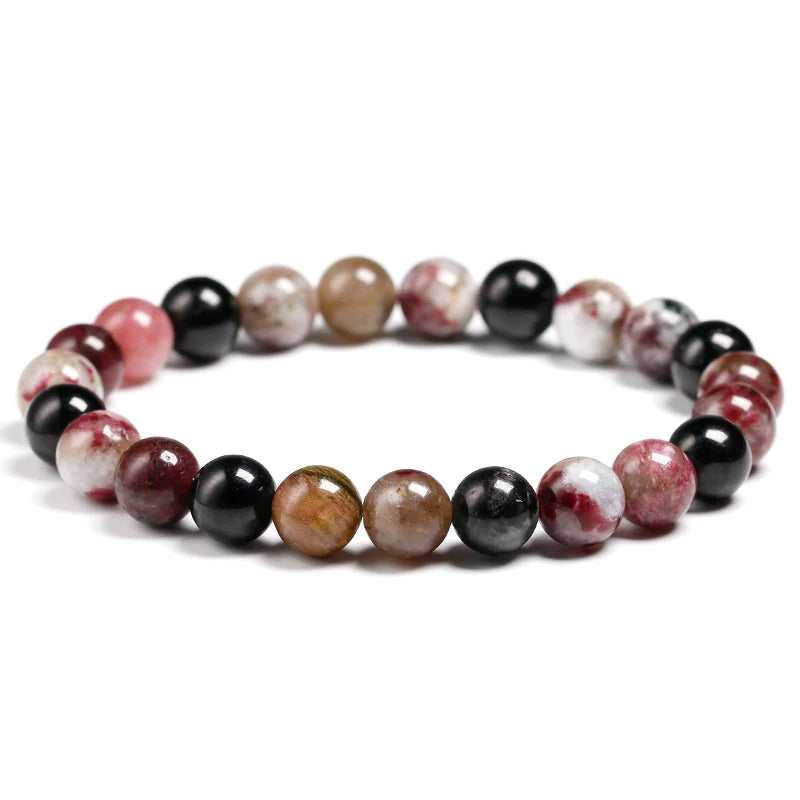 This elegant tourmaline bracelet showcases vibrant, multi-colored stones, perfect for adding a pop of color and positive energy to any outfit.